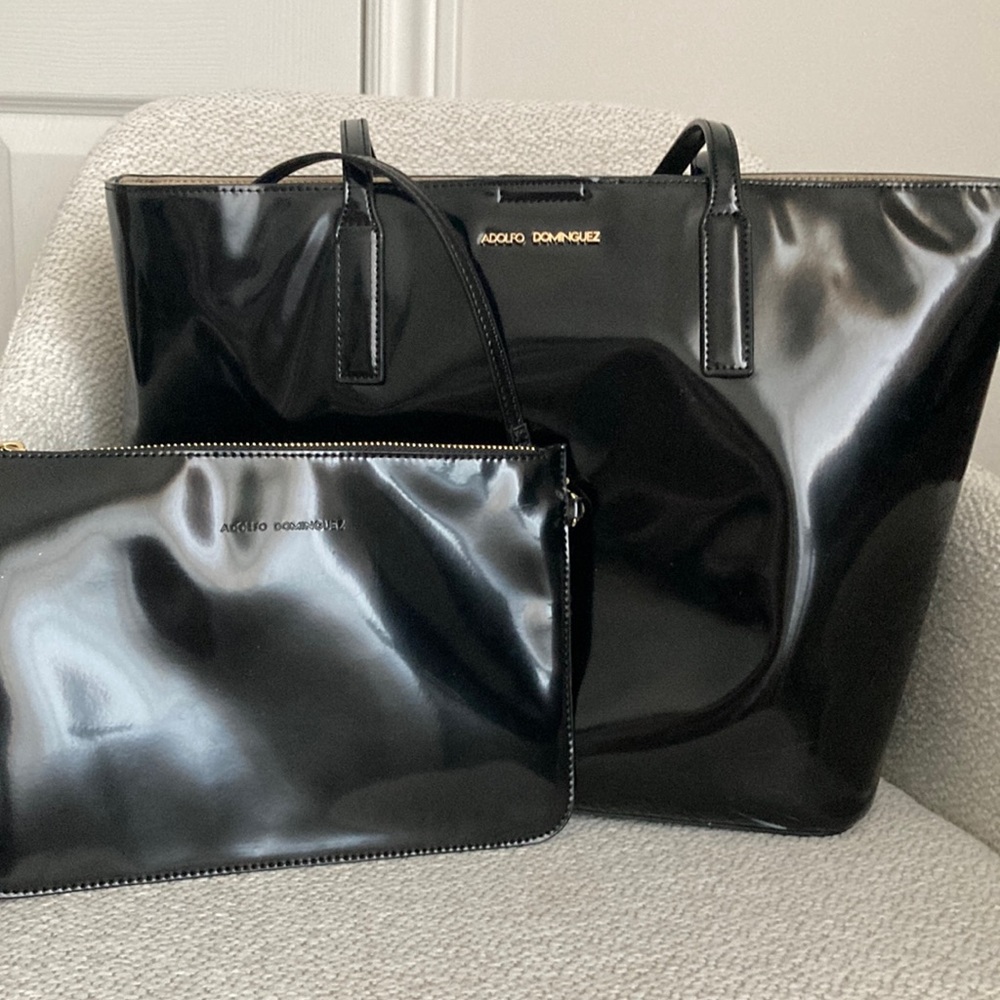 Large black tote bag with detachable wristlet
